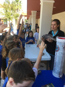 Hanna Garland of the Florida Fish and Wildlife Commission teaches students about the invasive Lionfish. (photo courtesy of Laddy Monahan)